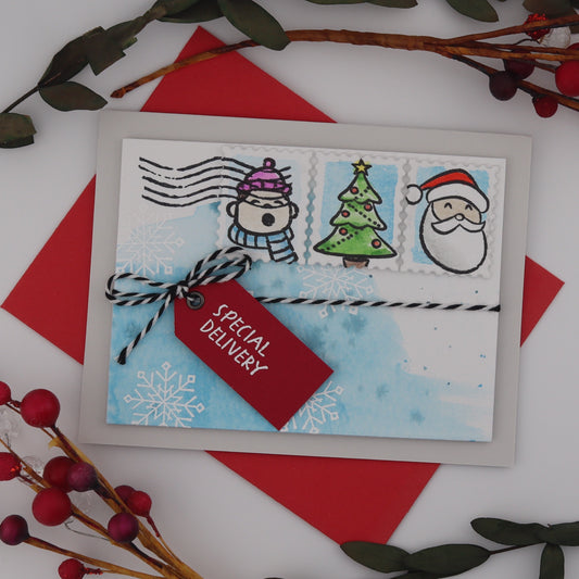 Christmas-themed card with Santa Claus, Christmas trees, and reindeer on a white background with red and green decorations.
