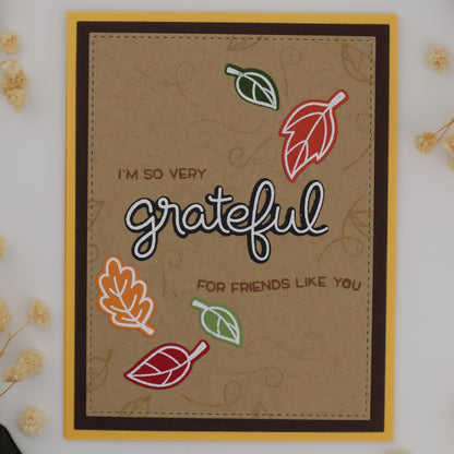 Card with 'I'm so very grateful for friends like you' text and leaf illustrations on a white background with flowers.