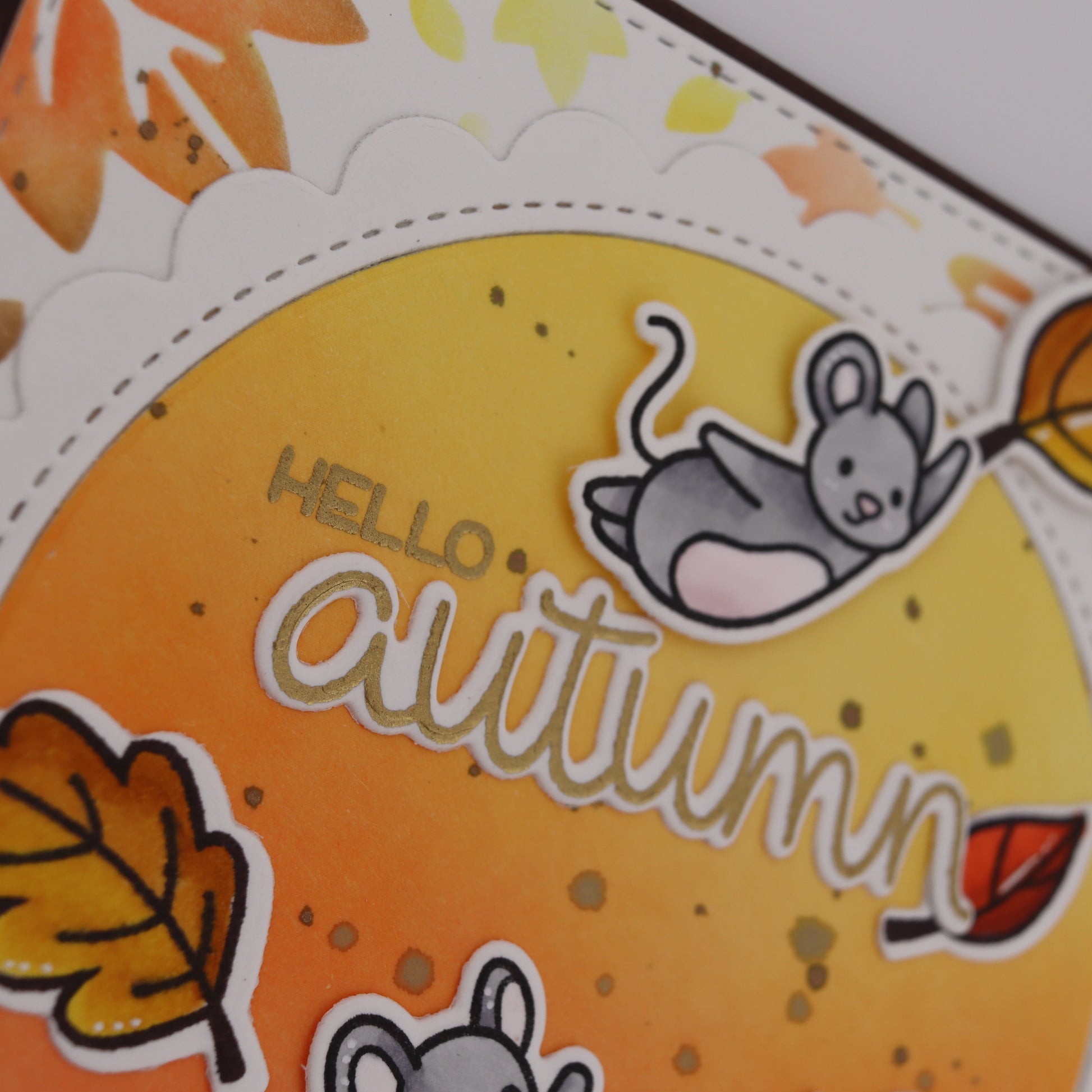 Autumn-themed card with a mouse and leaves on an orange background