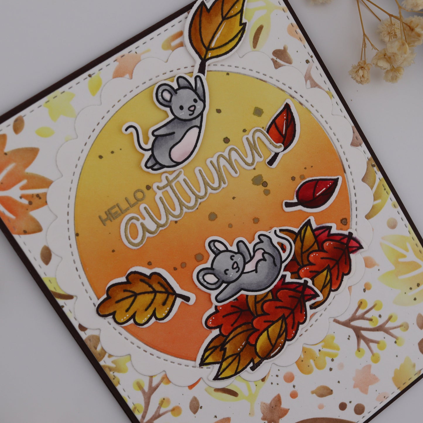 Autumn-themed card with leaves and a mouse design on a white background.