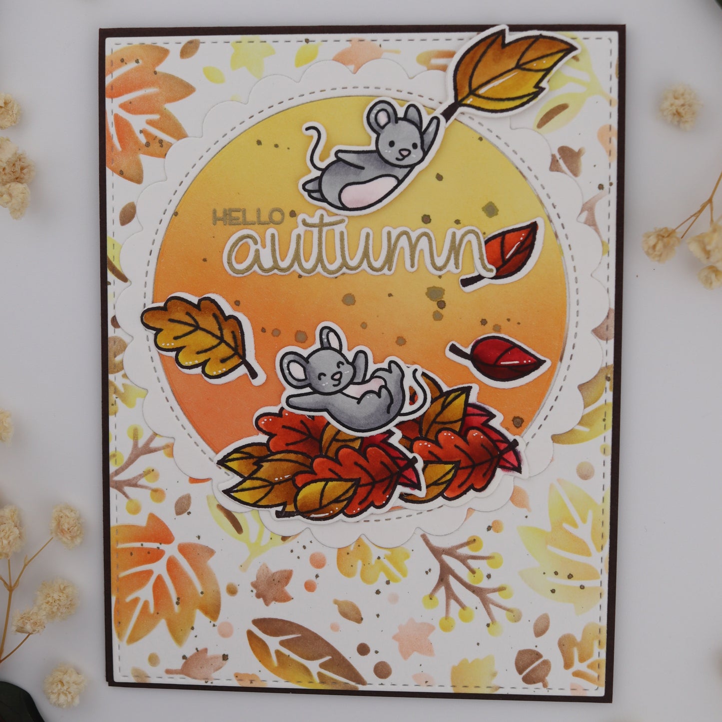 Autumn-themed card with leaves and a mouse design on a white background.
