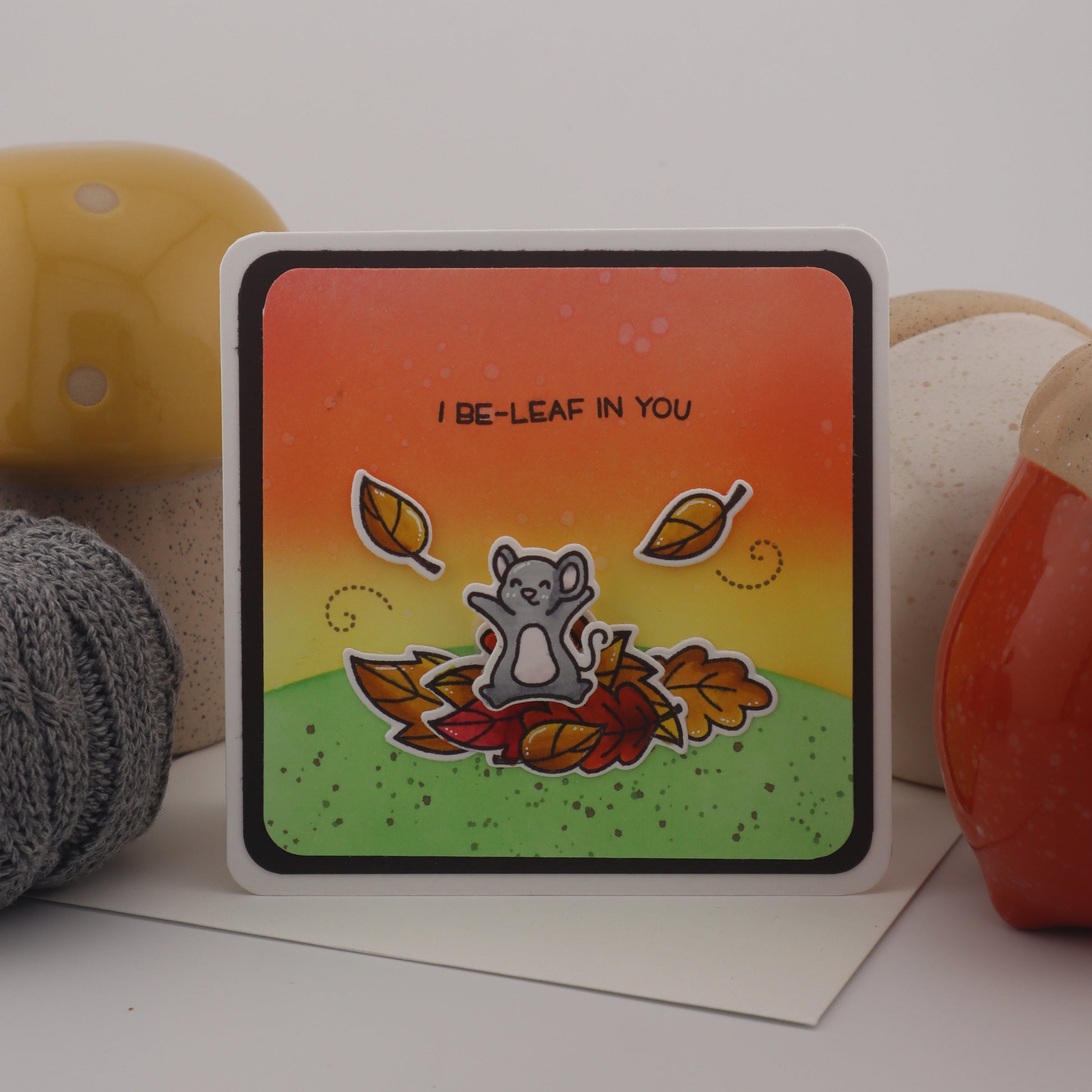 Colorful card with a bear illustration and text on a white surface