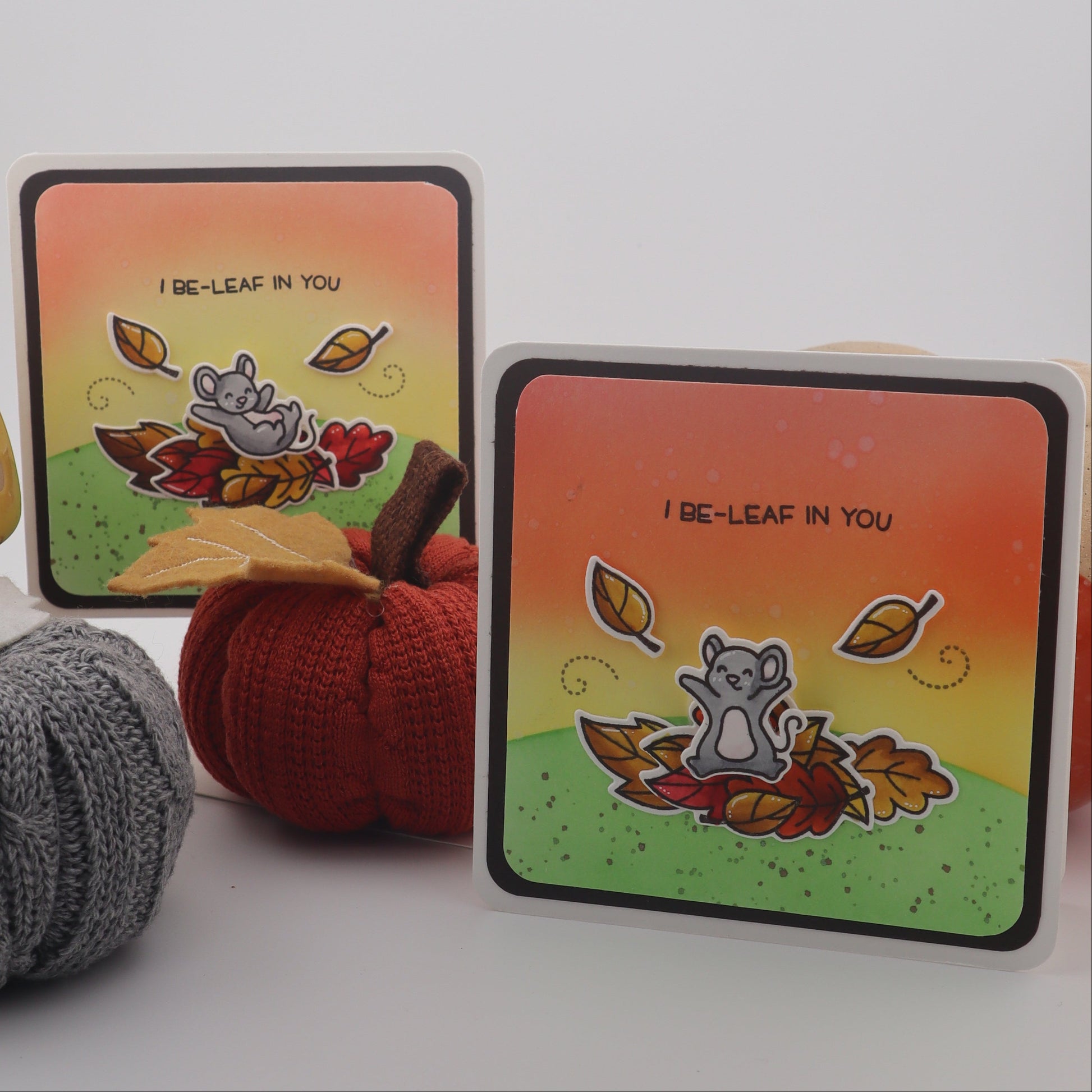 Two colorful coasters with a design on a white surface.