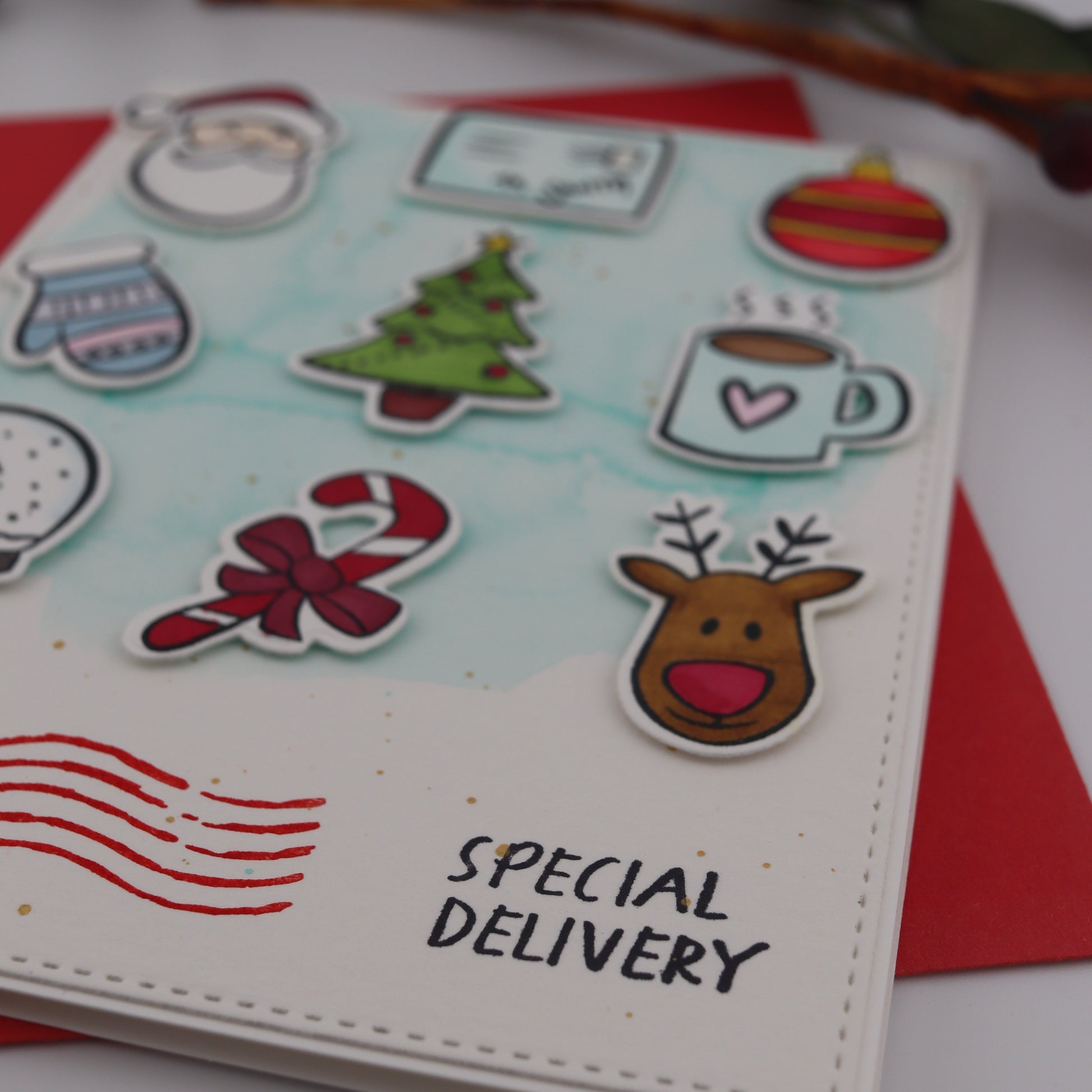 Christmas-themed card with stickers on a white background