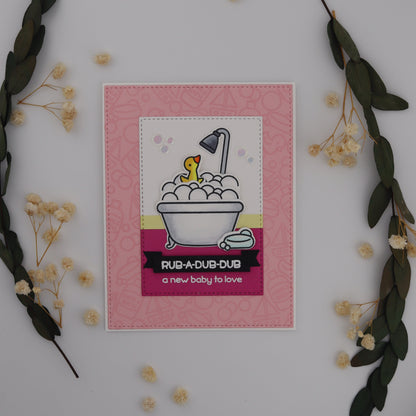 Small framed artwork with a pink border and decorative elements on a white background