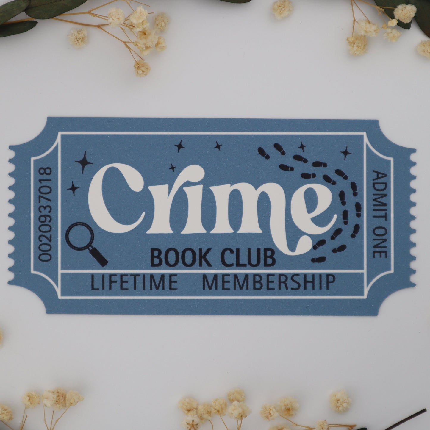 Blue ticket-style card for Crime Book Club lifetime membership on a white background with flowers and leaves.