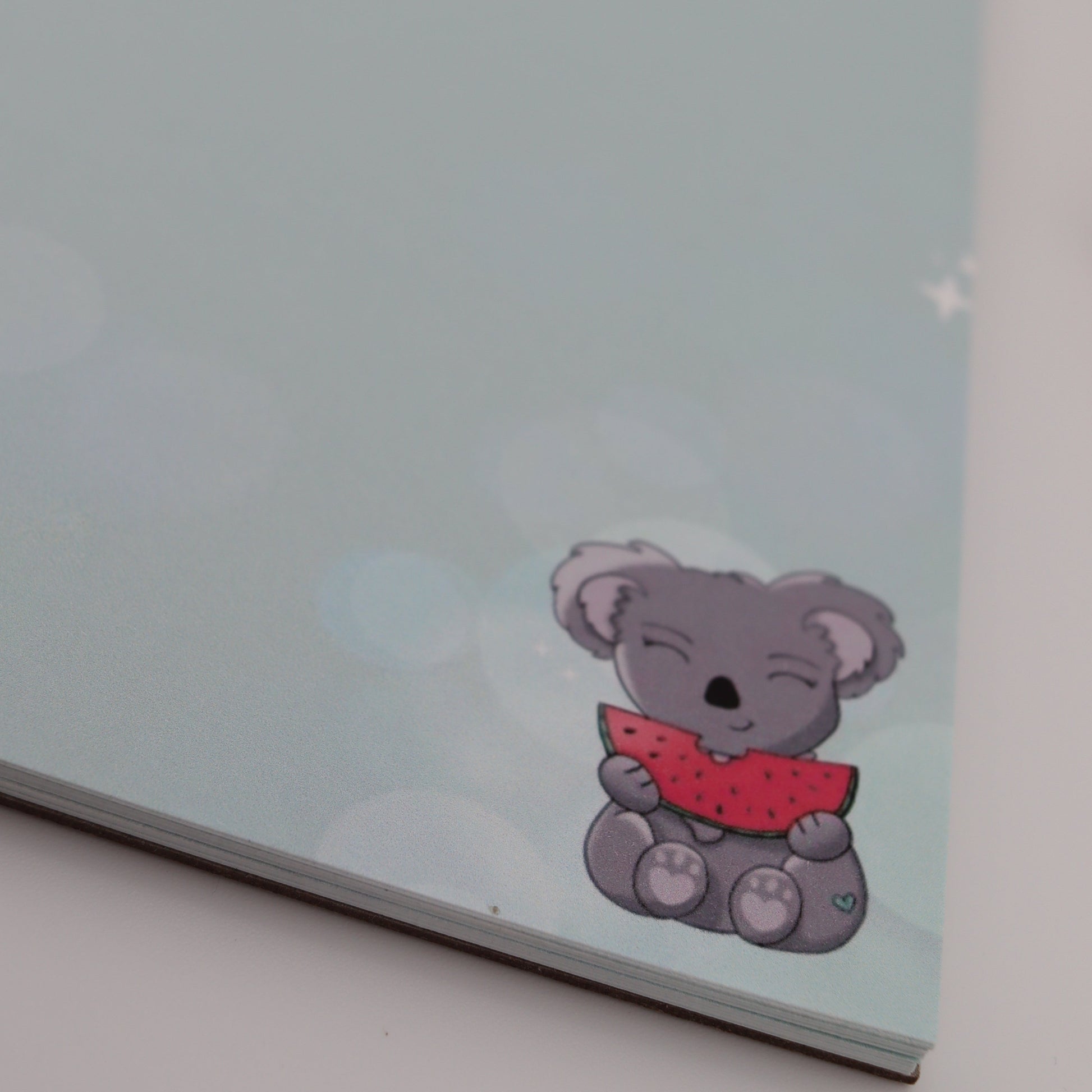 Note pad with a cartoon bear design on a light blue background