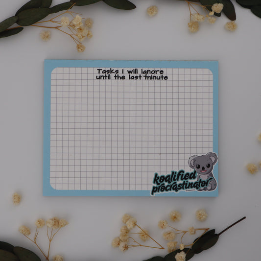Notebook with grid paper and text on a white surface with decorative elements