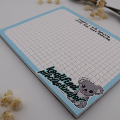 Notebook with grid paper and decorative elements on a light background