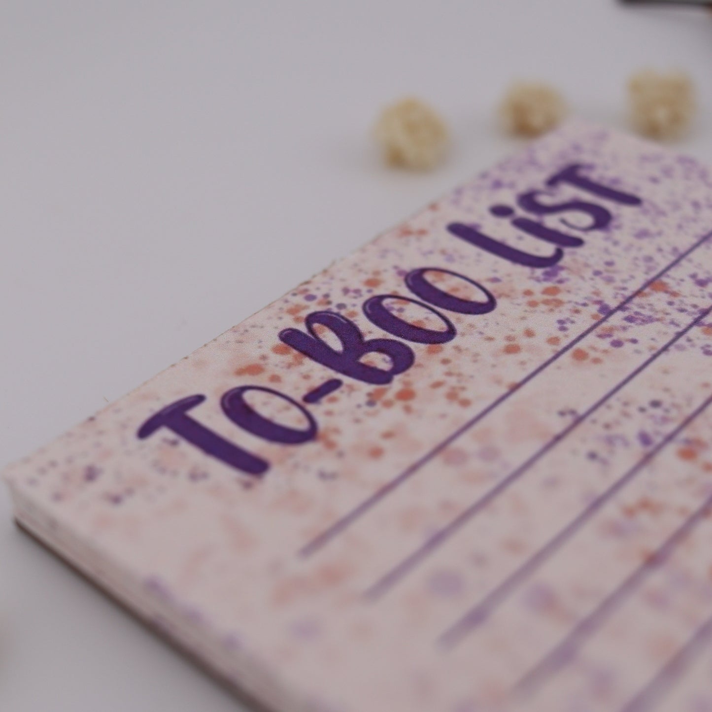 Notebook with 'To-Boo List' on a white background