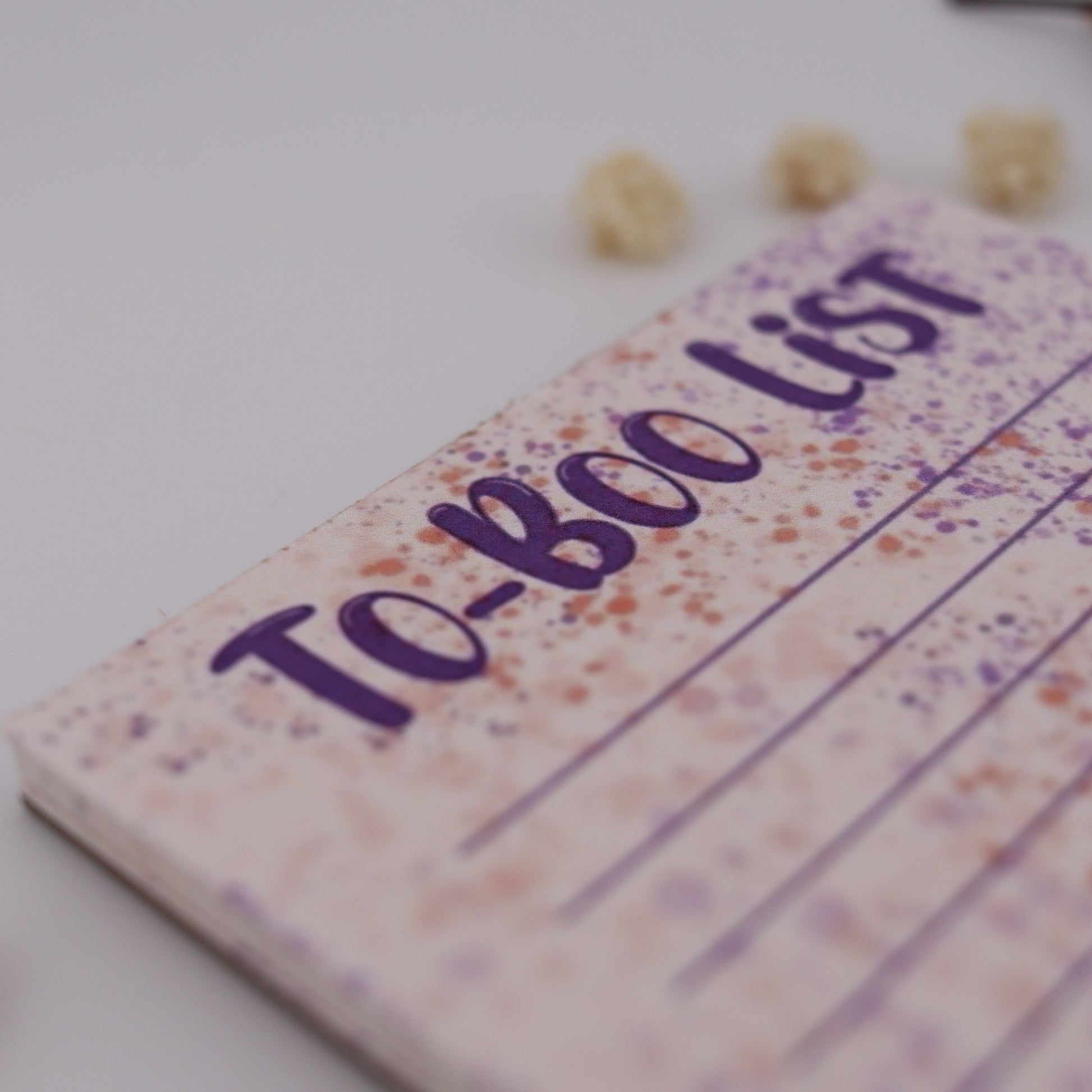 Notebook with 'To-Boo List' on a white background