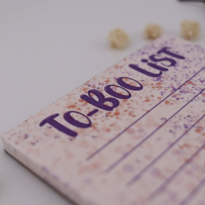Notebook with 'To-Boo List' on a white background